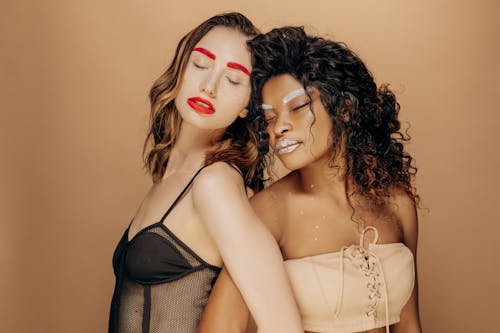 A Two Women Posing While Eyes Closed 