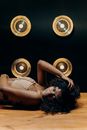 Woman in White Brassiere Lying on Floor