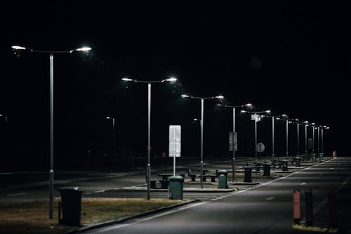 Free Street Lights In An Empty Lot At Nighttime Stock Photo