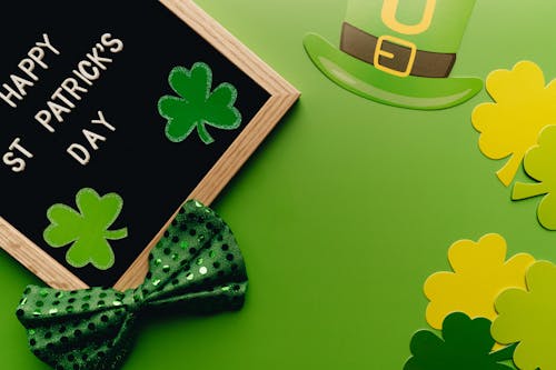 Decoration for St Patrick's Day with Green Bow Tie on Green Surface