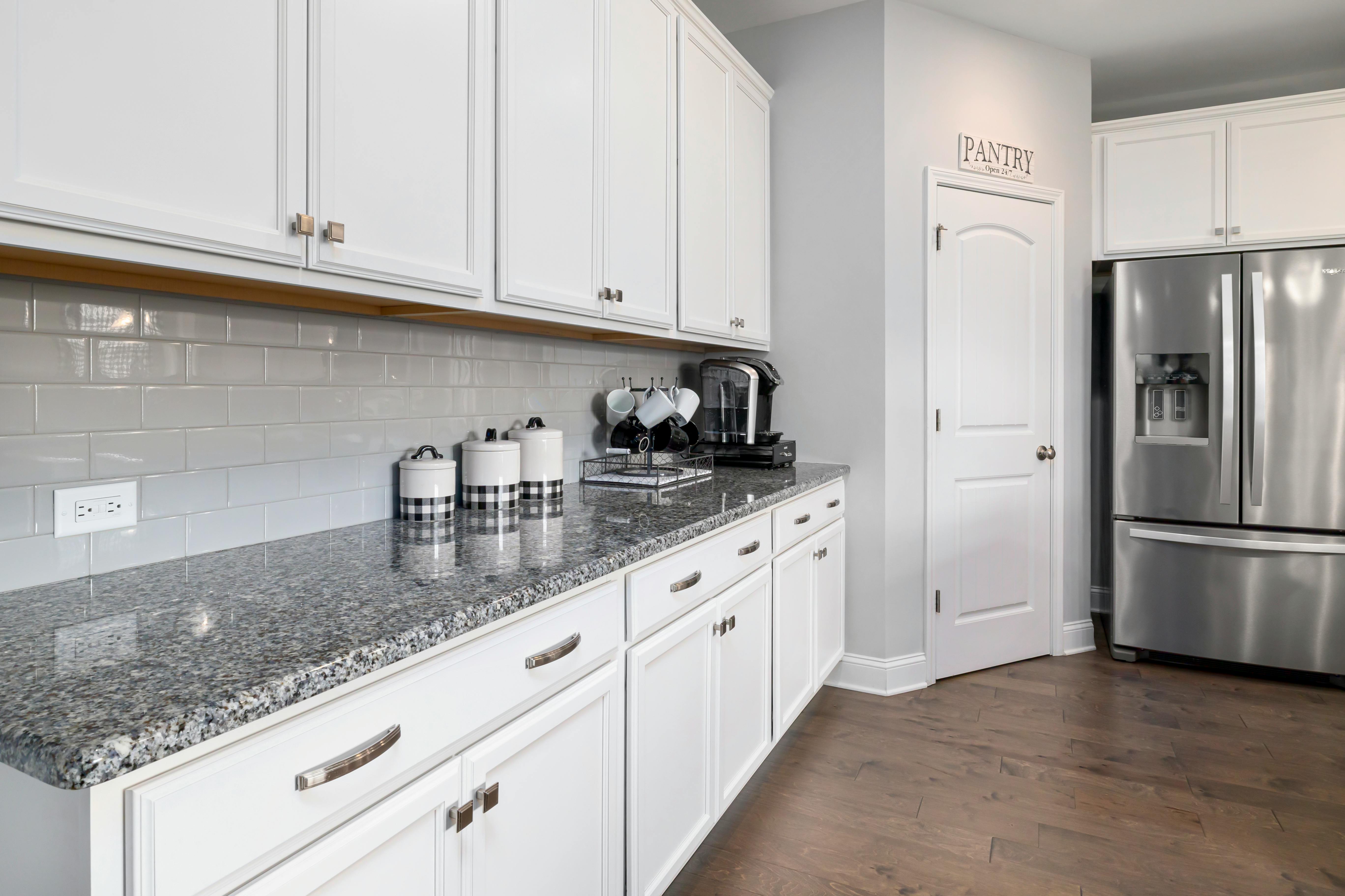 common mouse hiding spots in a home like behind appliances or in a pantry - emergency mouse exterminator