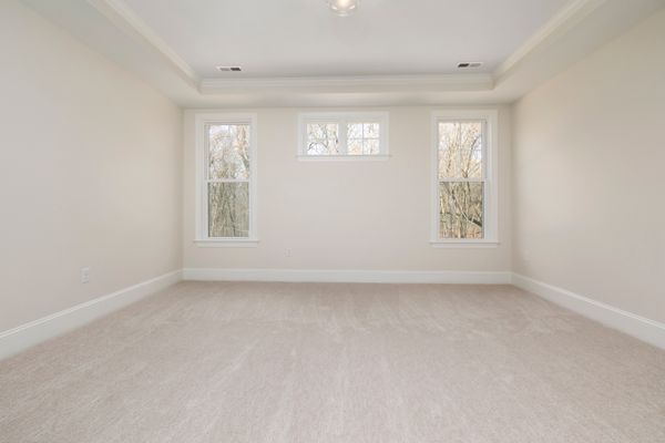 Cozy bedroom with plush carpet flooring