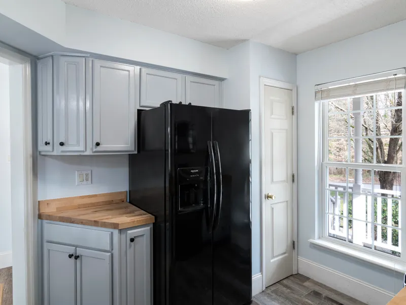 Refrigerator standing in a room of a home Refrigerator standing in a room of a home