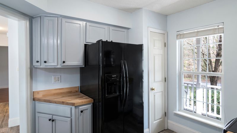 open full-size refrigerator in a bright home kitchen