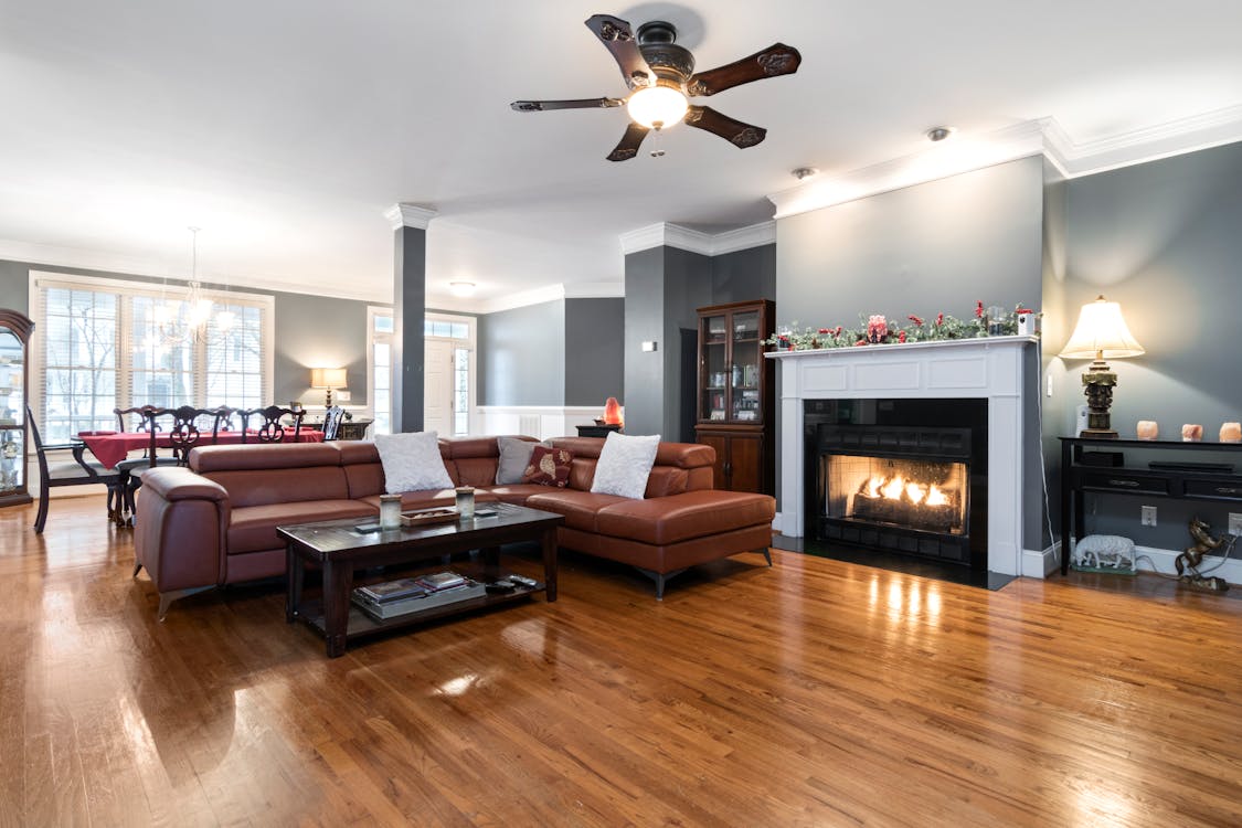 Spacious Interior with Fireplace and Shiny Wooden Floor