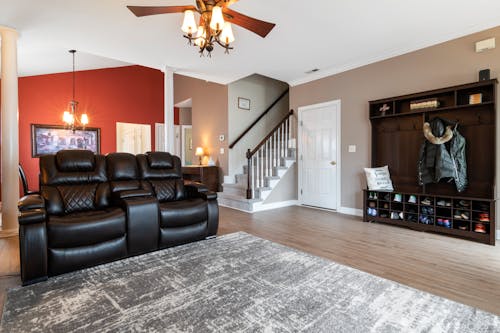 Black Leather Seat Sofa near Gray and White Rug