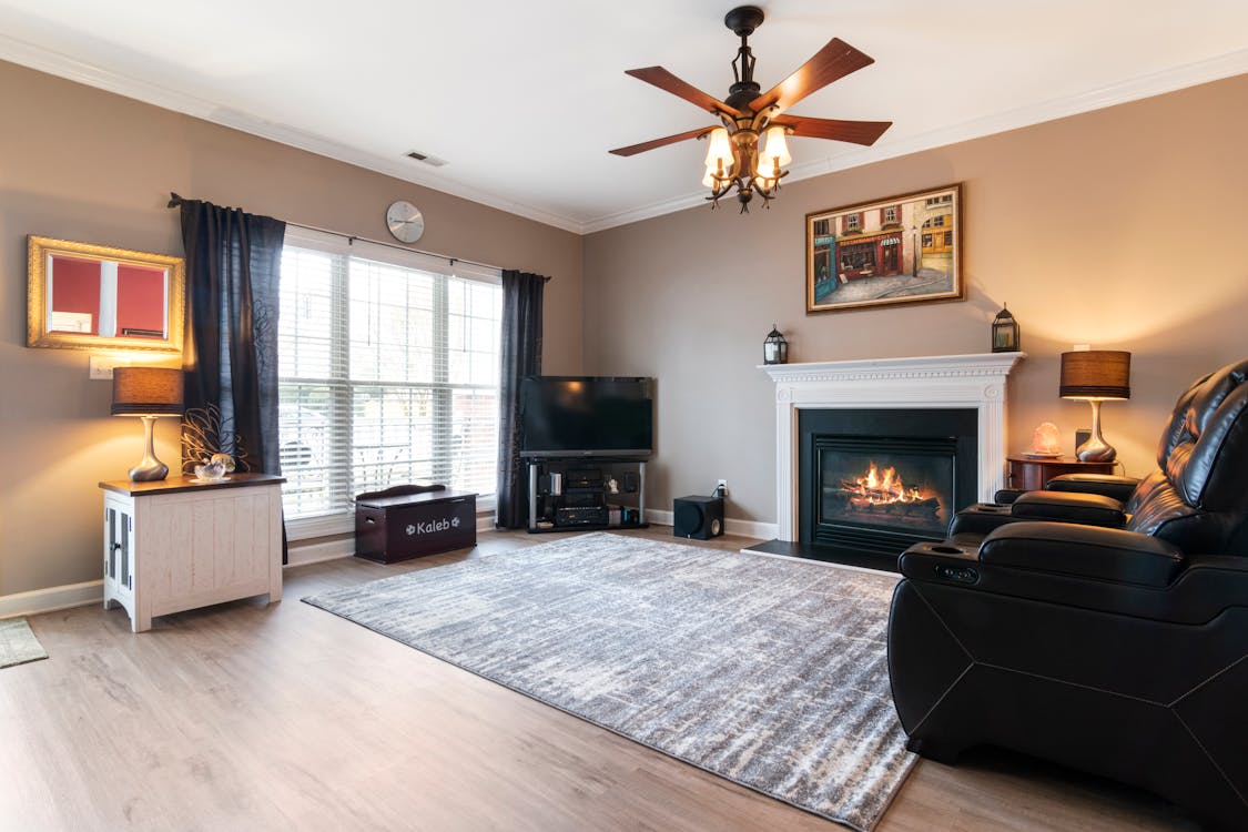 White and Gray Rug near Black and White Fireplace