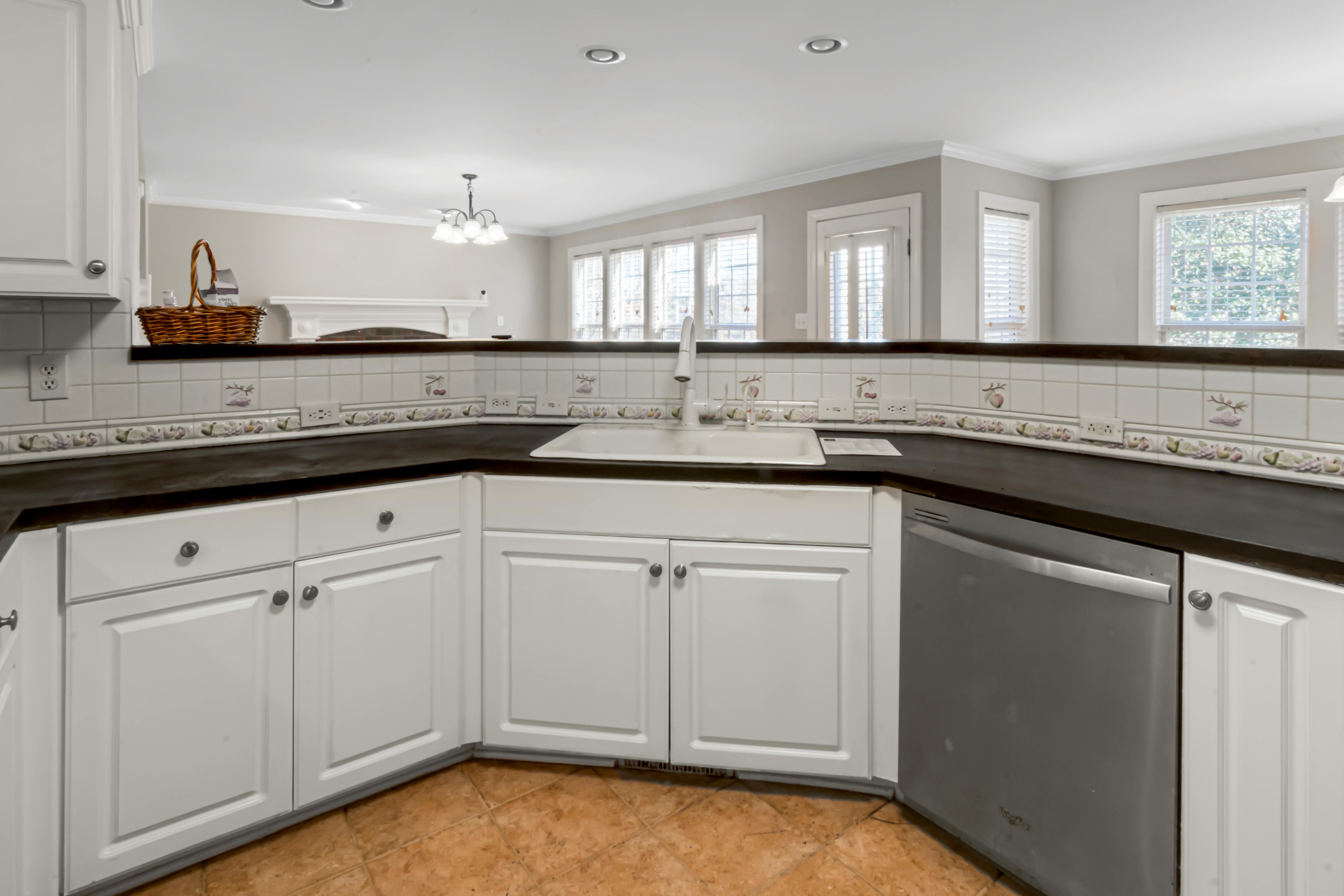 Free Spacious contemporary kitchen featuring minimalist design and elegant marble countertops. Stock Photo