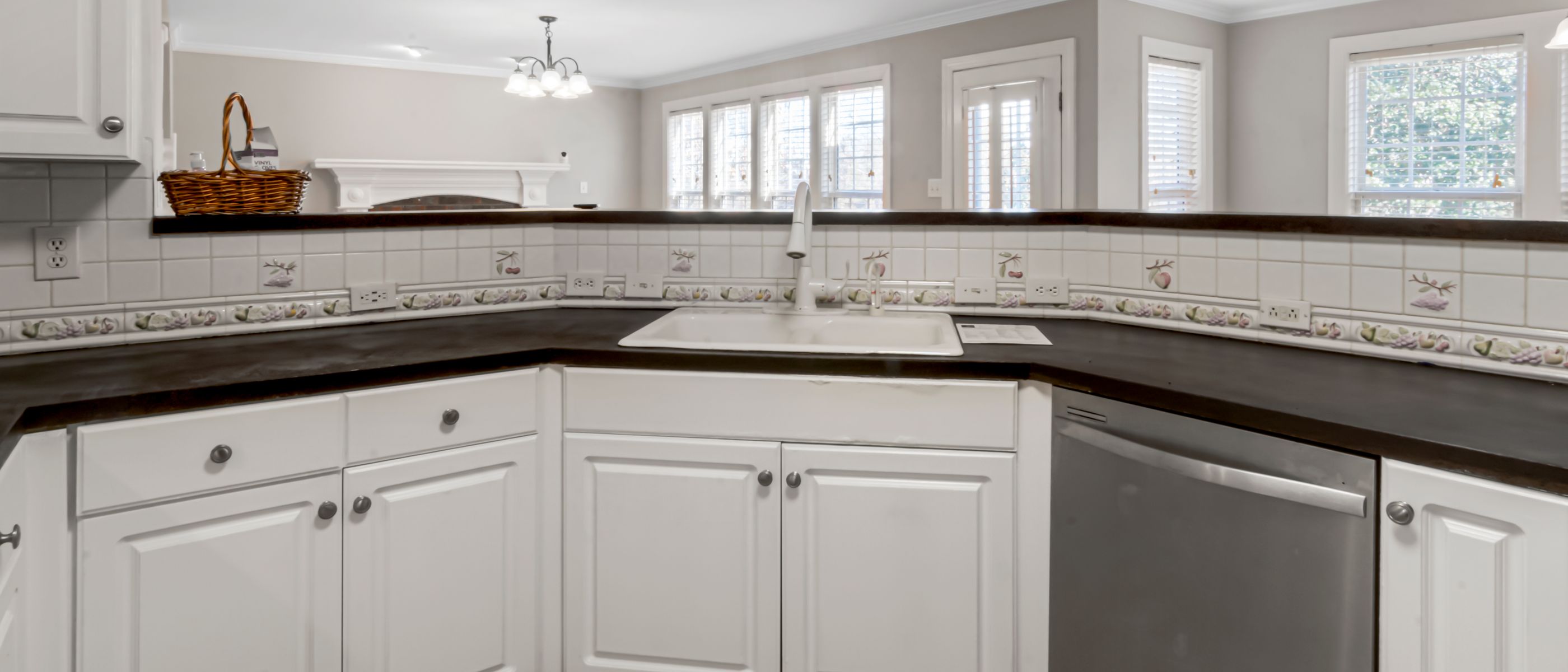 Kitchen Spraying in Wandsworth — clean edges cut in around trim and sockets