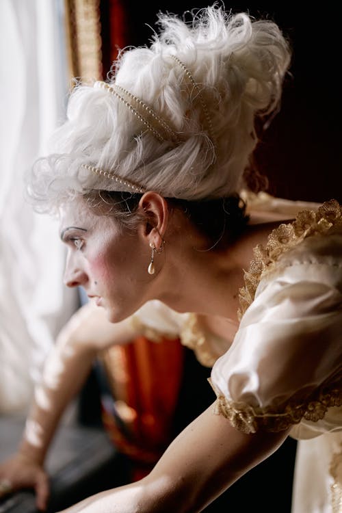 Person in a Theatrical Costume leaning on a Window