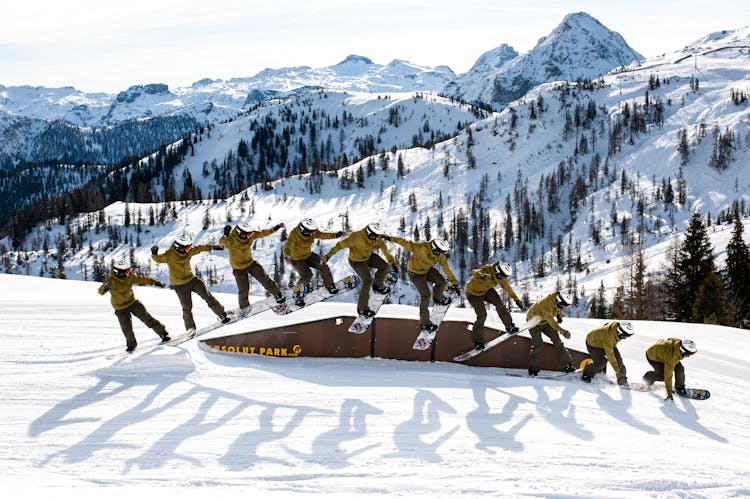 People Posing On Snowboards