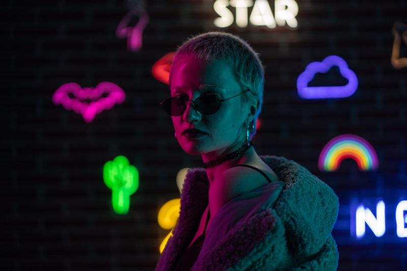 Portrait in neon-lit room — photo by Mikhail Nilov on Pexels