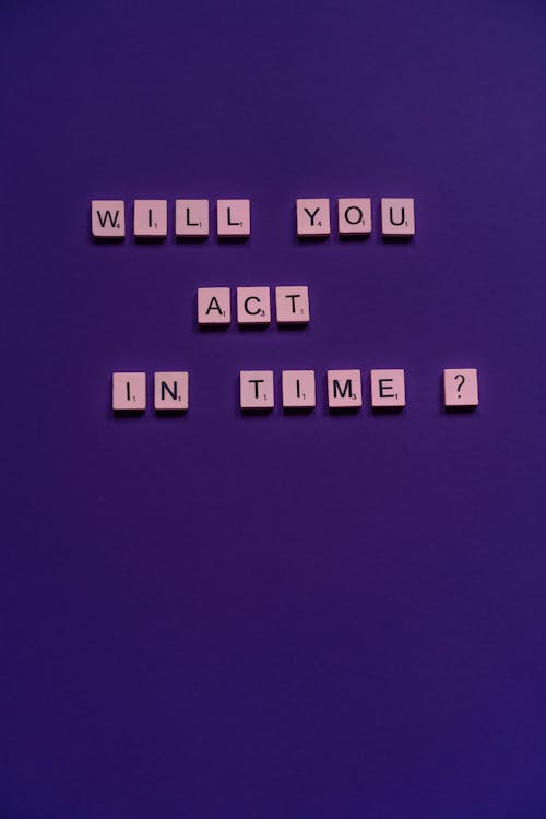 Scrabble Tiles on the Purple Background 