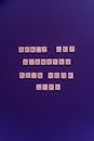 Letter Tiles on the Purple Background
