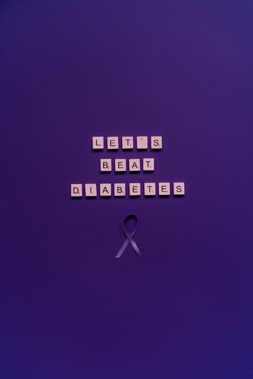 Scrabble Pieces and a Ribbon on the Purple Surface