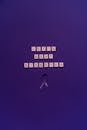 Scrabble Pieces and a Ribbon on the Purple Surface