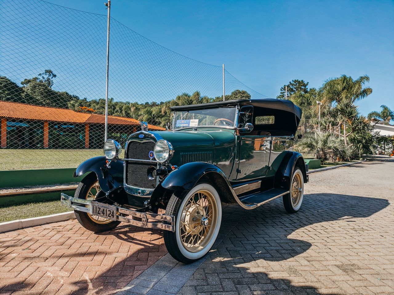classic vintage car parked outdoors with clear blue sky showcasing ret