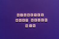 Scrabble Tiles on Purple Background