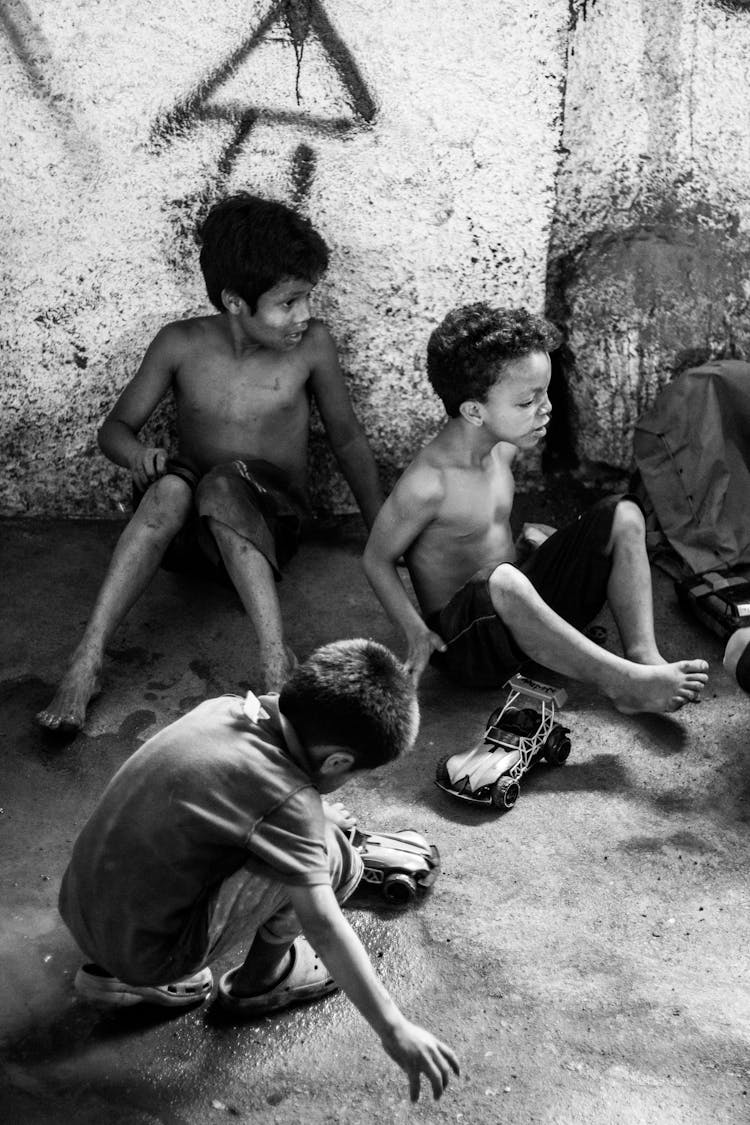 Little Ethnic Children Playing With Toys On Street