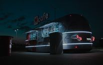 Food truck with shiny headlights parked on street