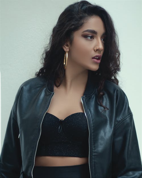 Beautiful Woman in Black Leather Jacket Looking Afar