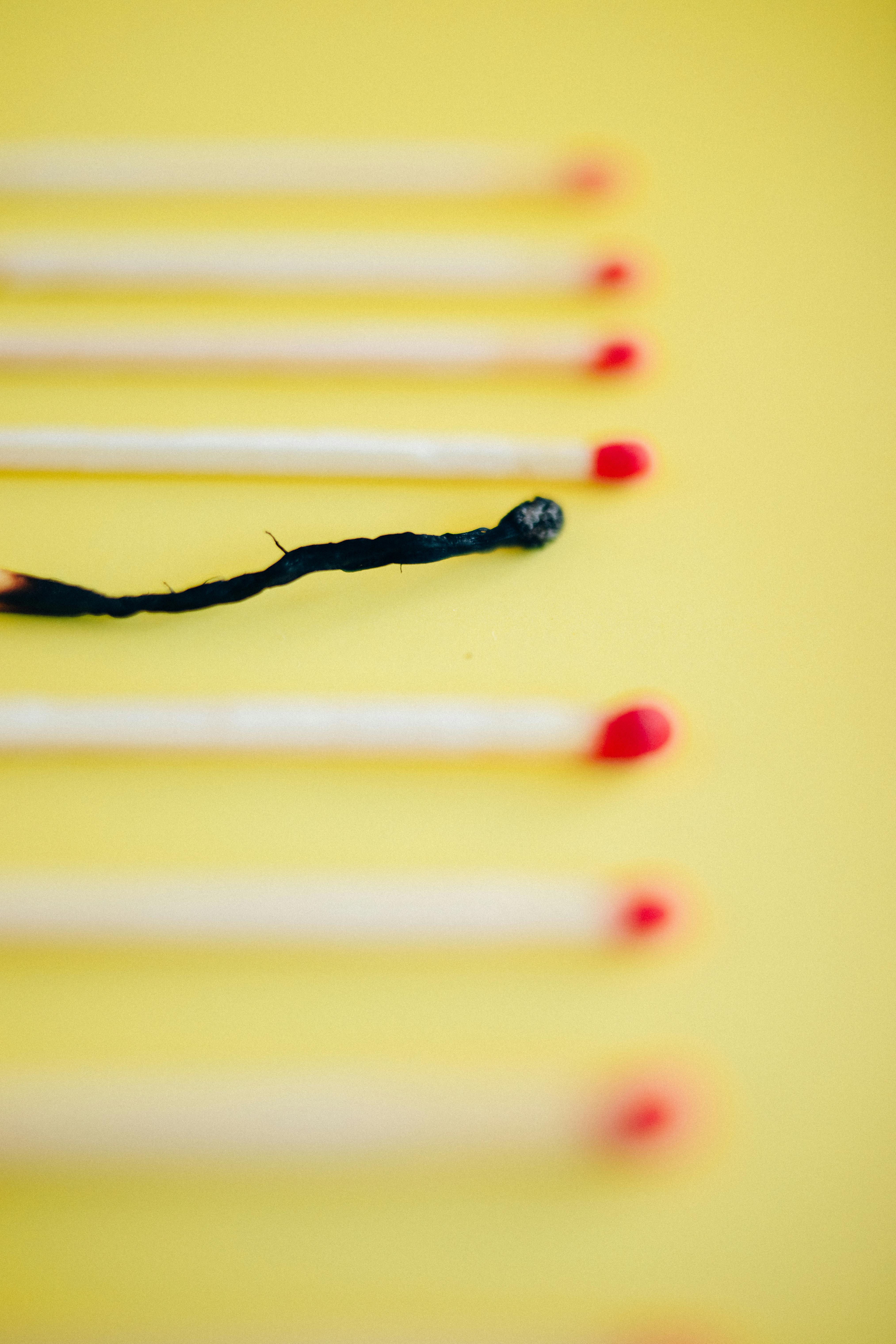 burned match stick in tilt shift lens