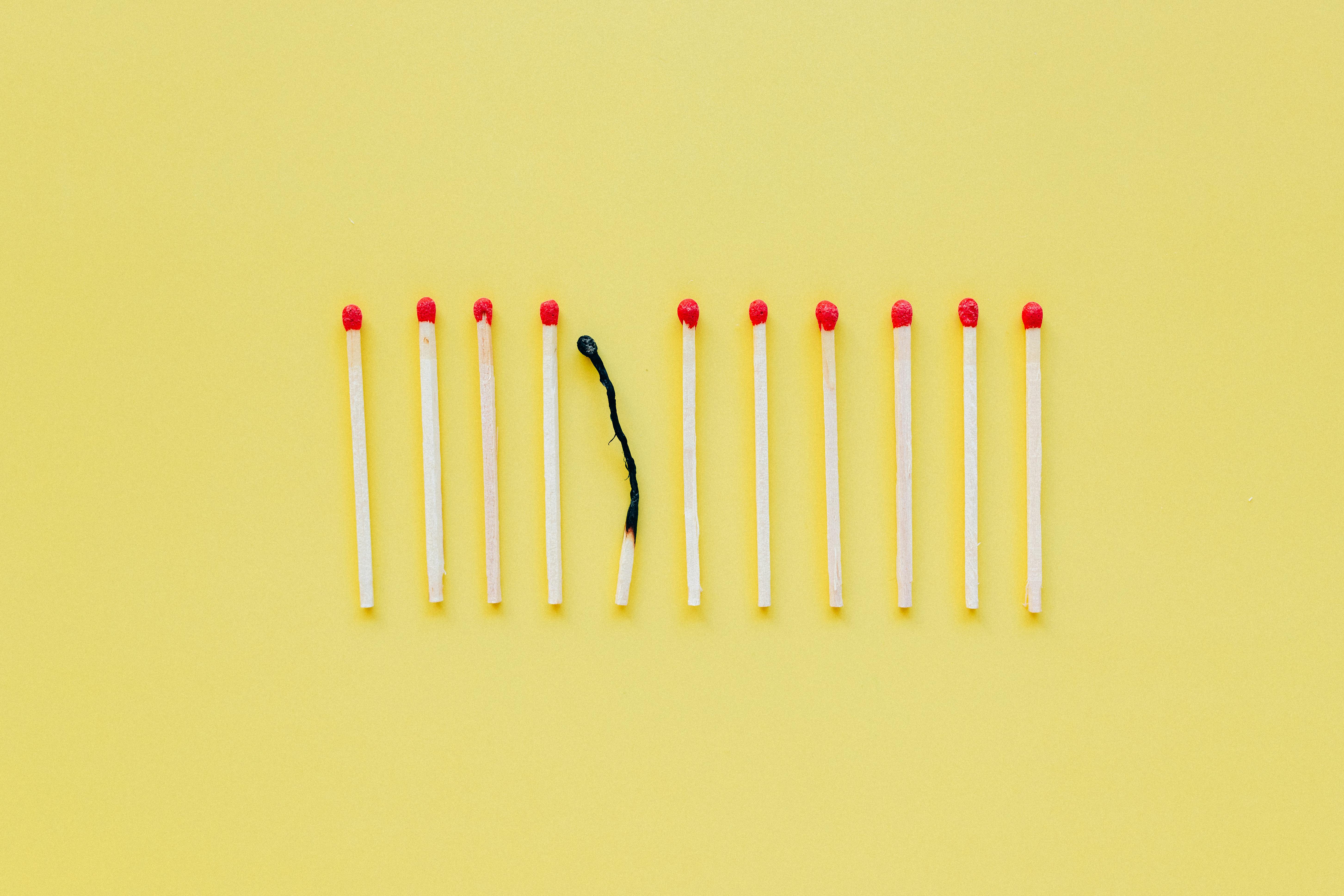 matchsticks on the yellow surface