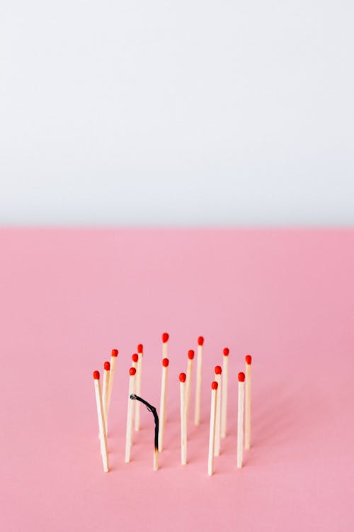 Free Pink Surface with Matchsticks Stock Photo