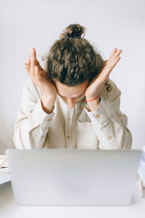 Free An Exhausted Man Working on His Laptop Stock Photo