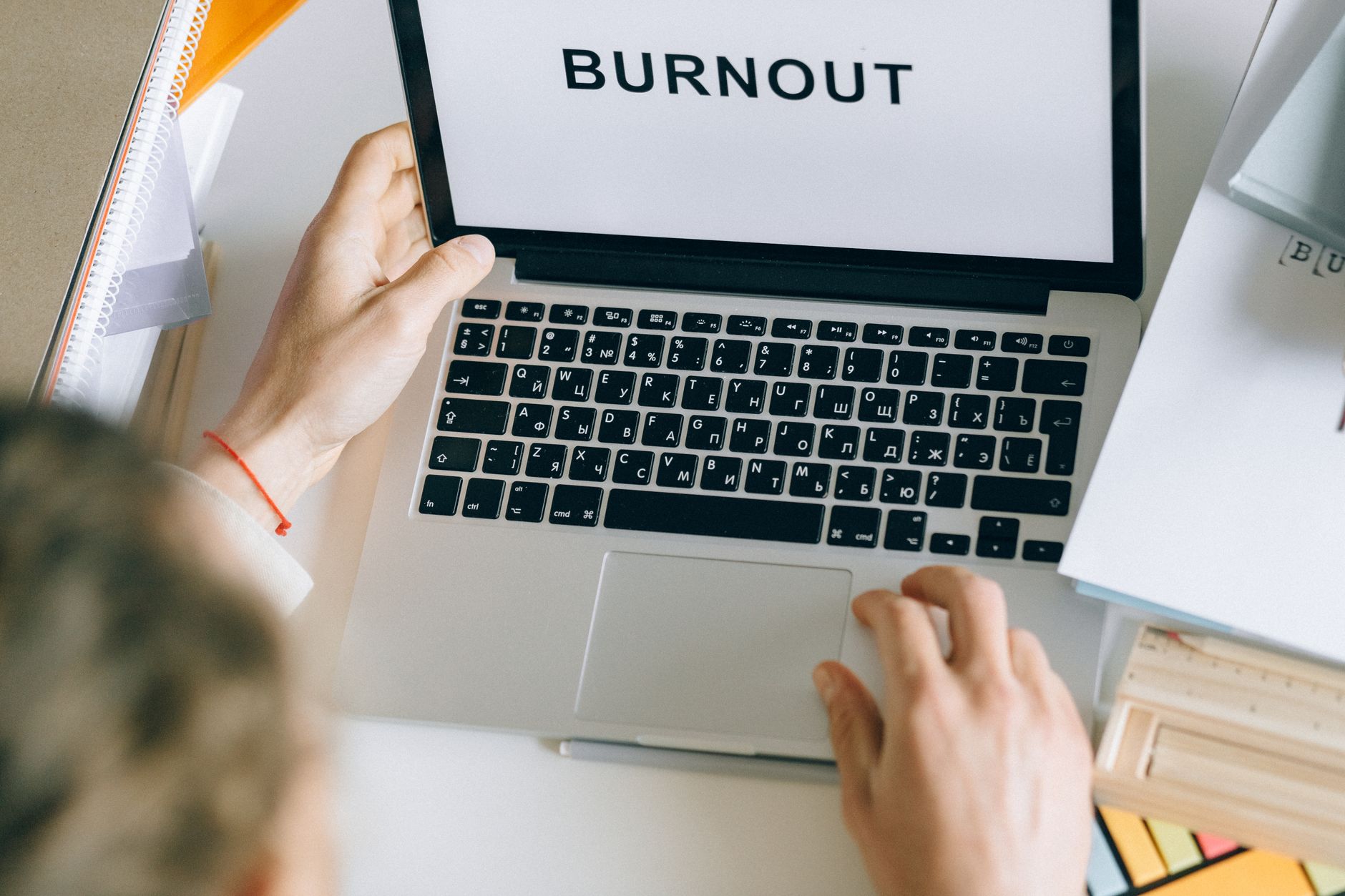 frustrated person editing poor transcript on laptop screen