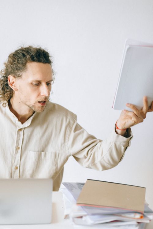 Anxious employee holding documents