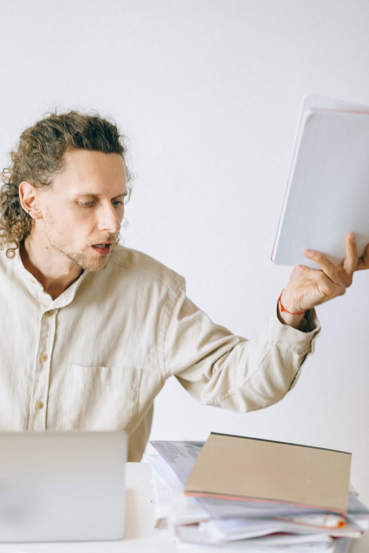 Anxious Employee Holding Documents