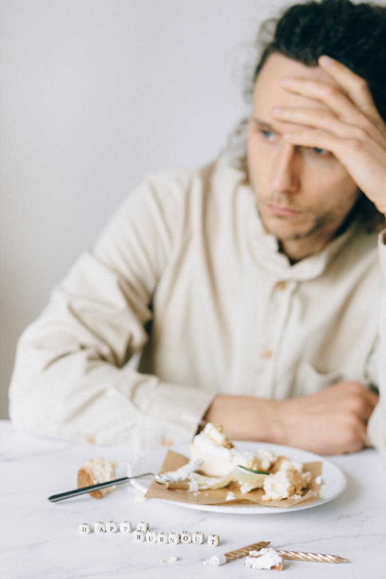 Anxious Employee In Front Of An Eaten Cake