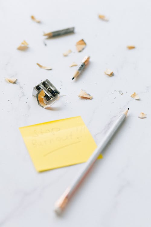 Free Sharpener and Pencil on Marble Surface  Stock Photo