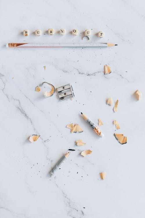 Sharpener and Pencil on Marble Surface 