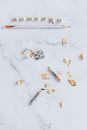 Sharpener and Pencil on Marble Surface