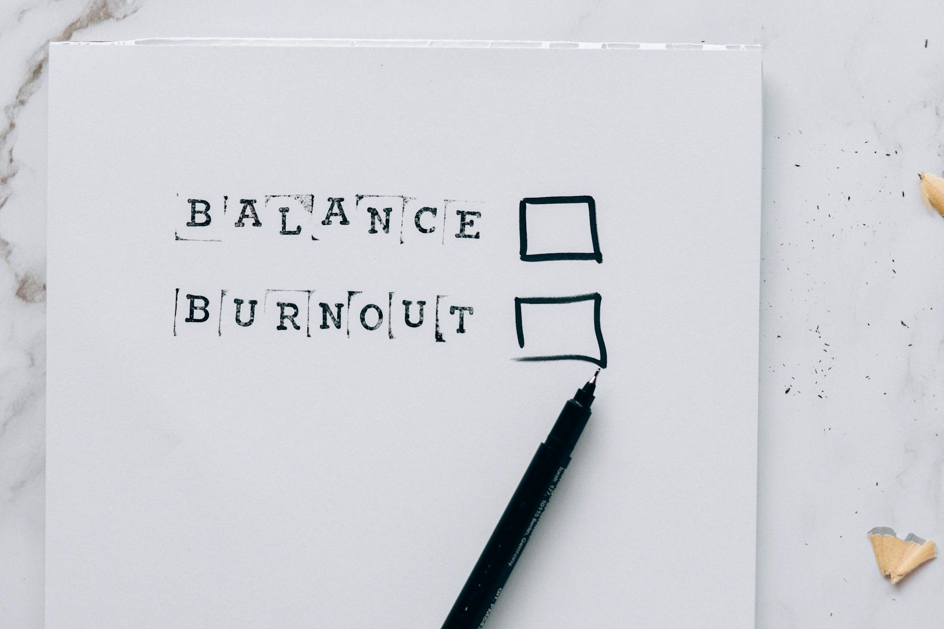 A minimalist image depicting the choice between balance and burnout with checkboxes.