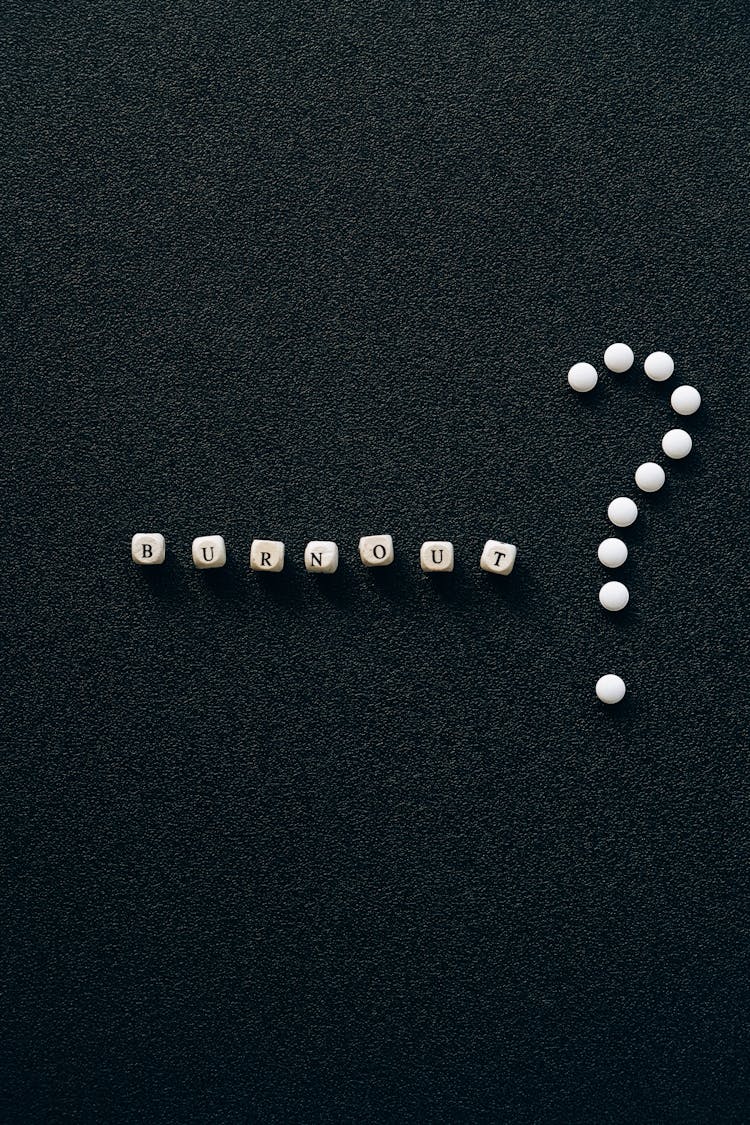 Letter Beads On Black Surface