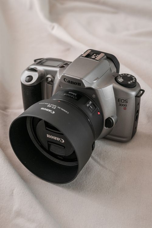 Free Detailed close-up of a classic Canon EOS 3000 camera on a neutral background. Stock Photo