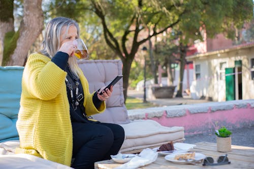 Free Woman Drinking Tea on a Park Stock Photo