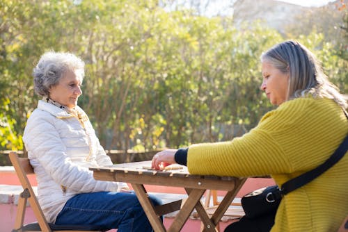 Free Elderly Women Playing a Game of Dominoes Stock Photo