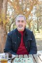 Man in Black Jacket  and Red Shirt