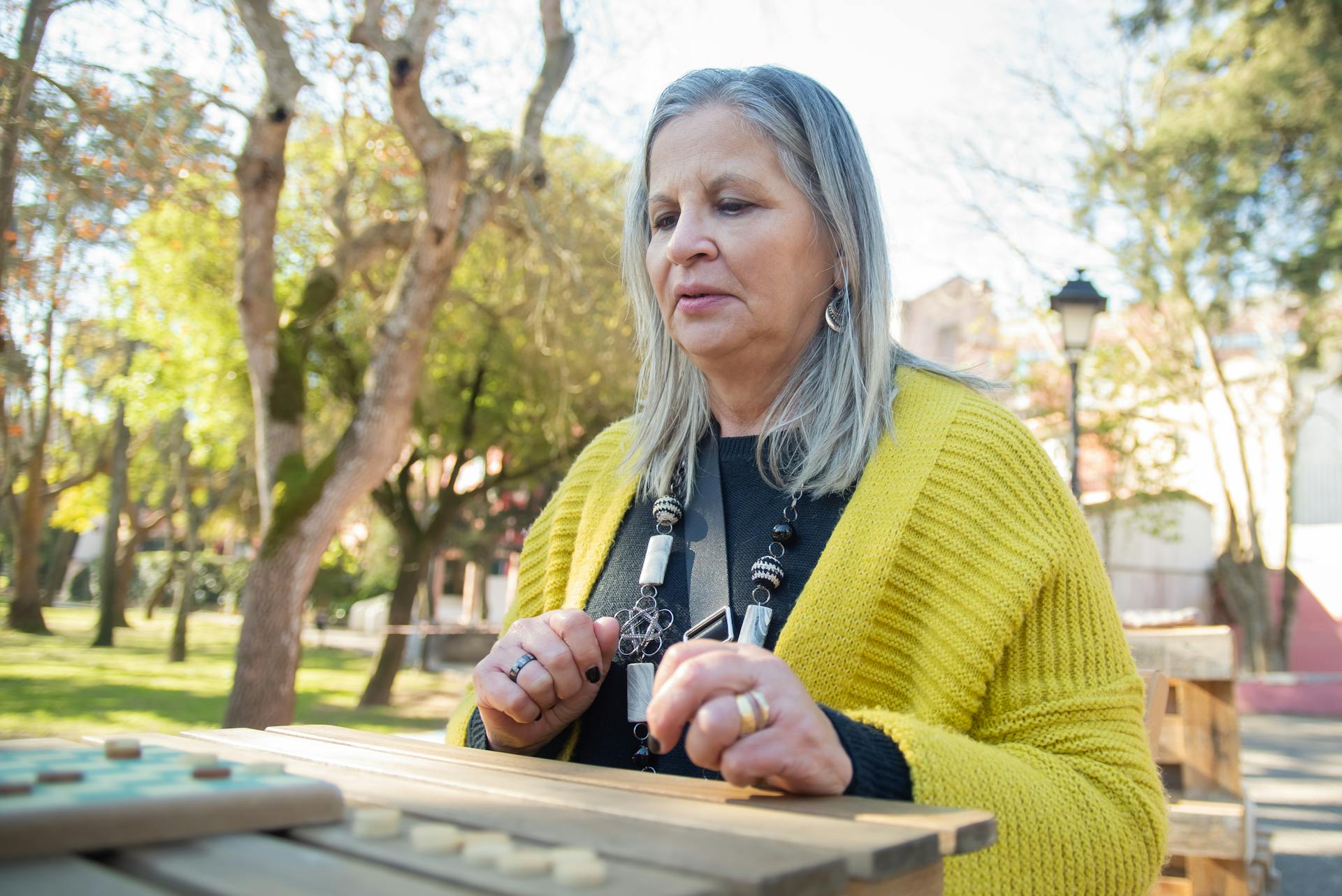 Elderly Woman in Yellow Cardigan