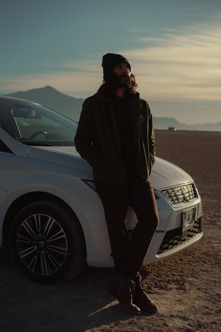 Bearded Man Leaning On White Car