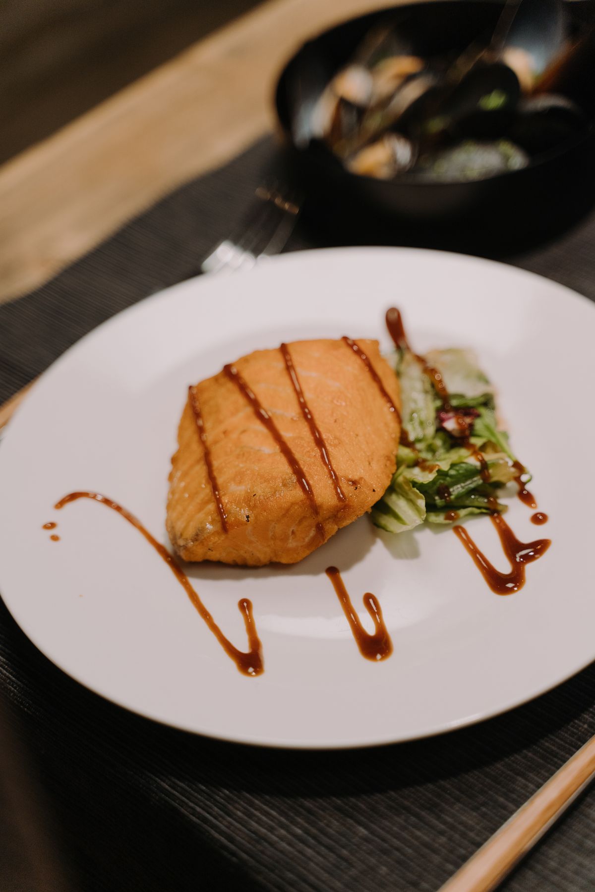 Cooked sturgeon fillet served with sauce and lemon, the steak of the sea
