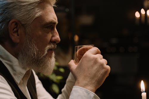 Free Close-Up Shot of a Man Holding a Glass  Stock Photo
