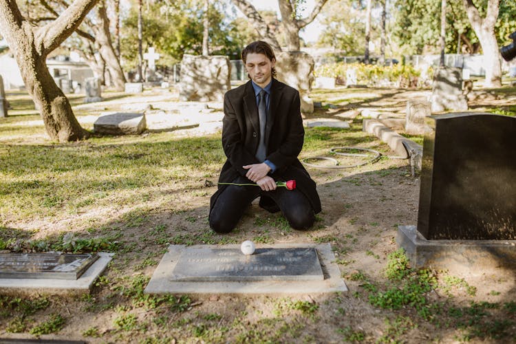 
A Man Visiting In The Cemetery