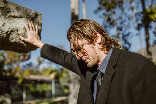 Grieving Man in Black Suit 