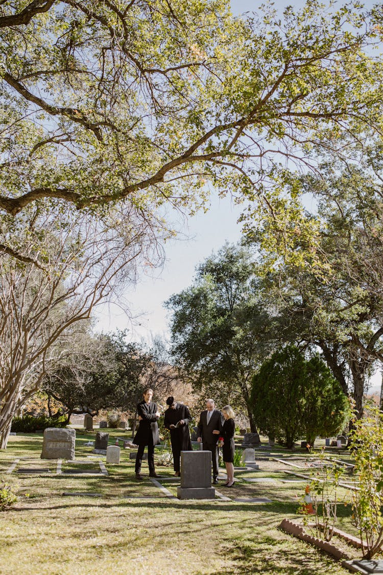 People Standing In The Cemetery