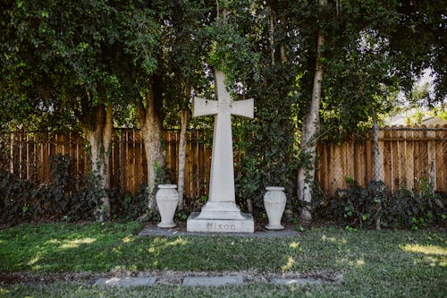 White Concrete Cross on Tombstone